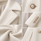 LYRA | Le manteau péplum à boutons perlés